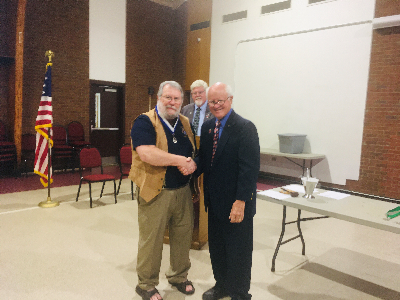 Worthy Trustee Bob Hall Congratulates Worthy Lecturer Ralph Houser
